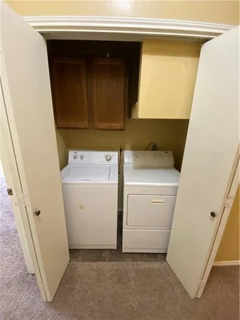 a bathroom with a granite countertop sink mirror vanity and toilet