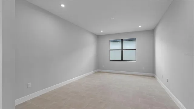 a bathroom with a sink and mirror with toilet