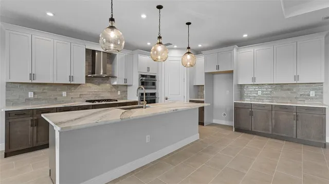 a large kitchen with cabinets