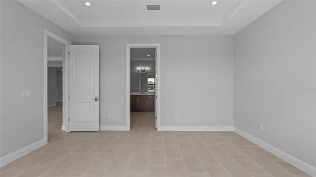 a view of an empty room and closet area