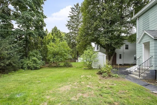 a view of a backyard of the house