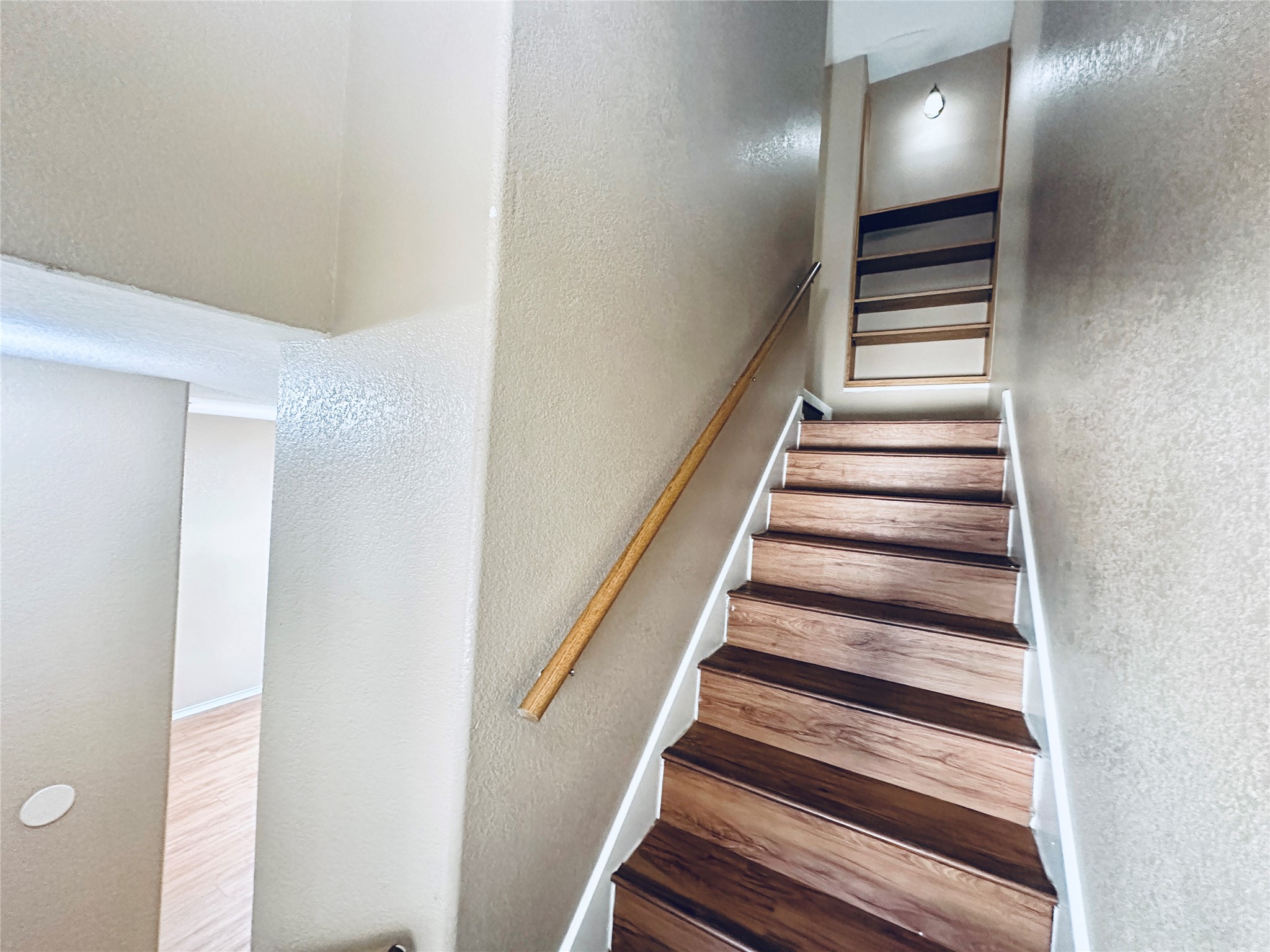 8814 Schick Road, Unit B Austin, TX 78729 - Photo 19 of 36 Stairway featuring a textured wall