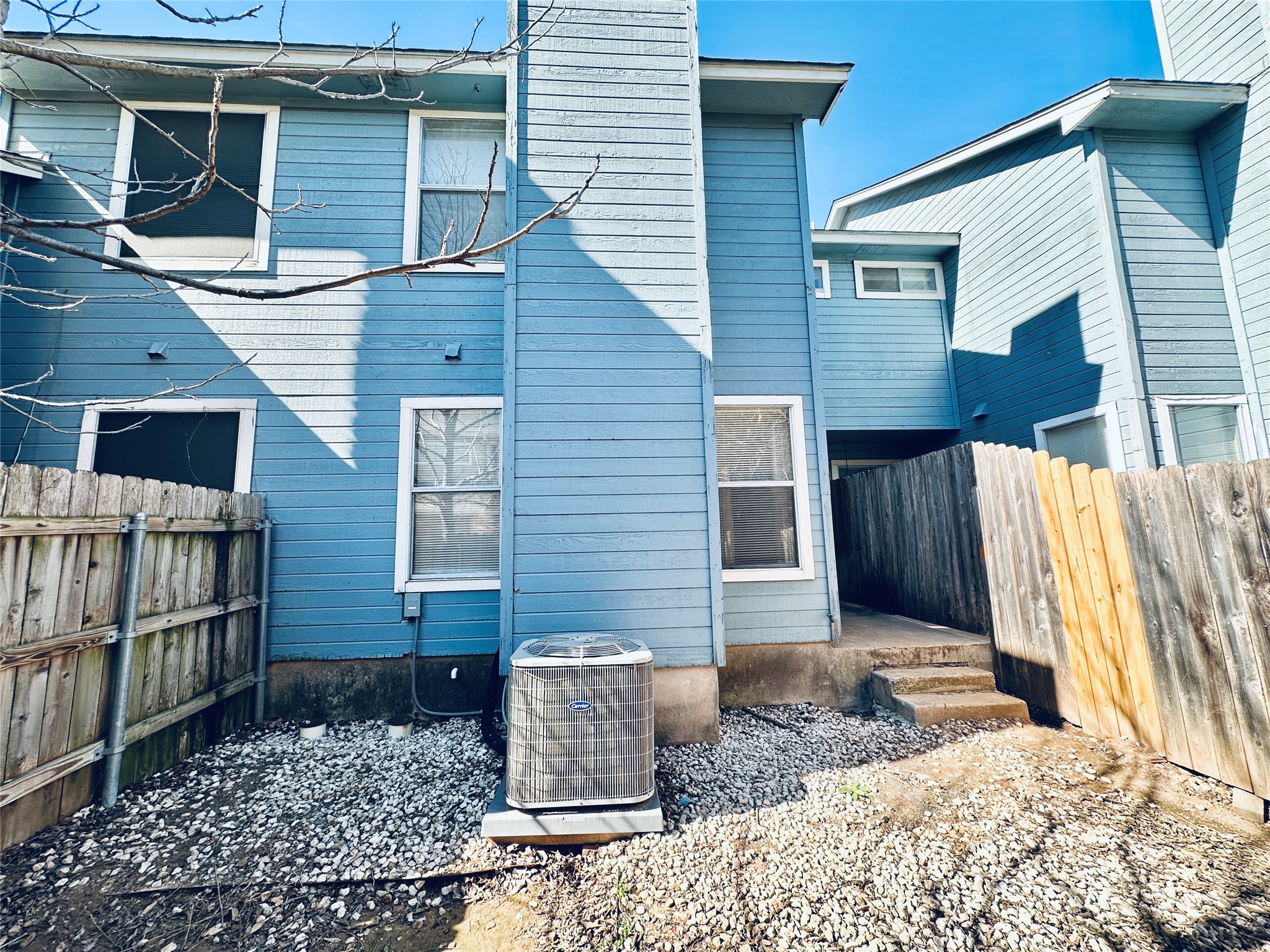 8814 Schick Road, Unit B Austin, TX 78729 - Photo 36 of 36 Rear view of house featuring a fenced backyard