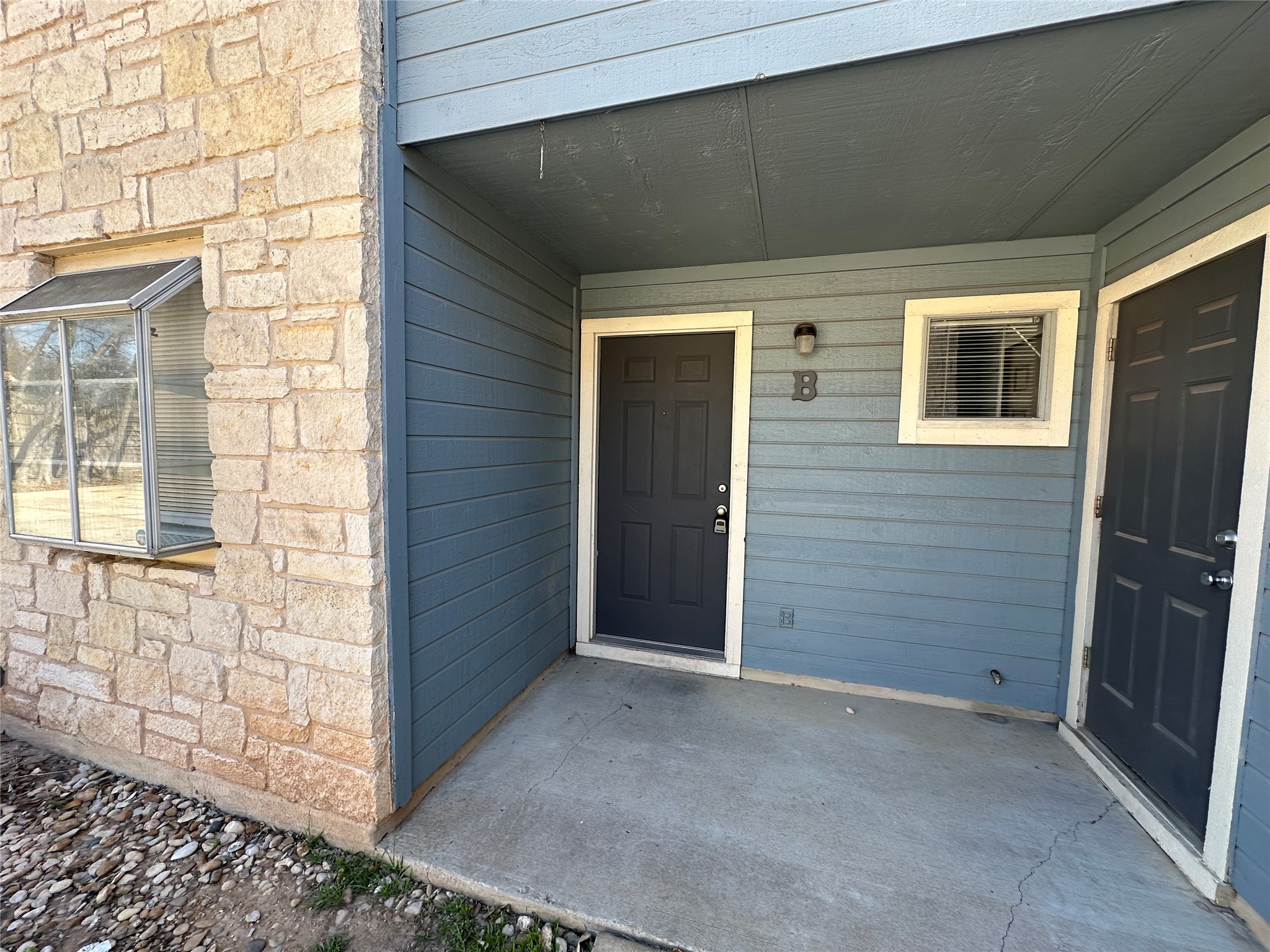 8814 Schick Road, Unit B Austin, TX 78729 - Photo 4 of 36 Entrance to property featuring stone siding