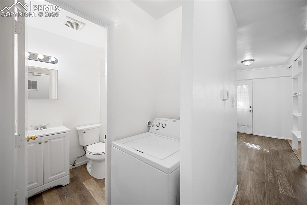 357-359 Fairway South Colorado Springs, CO 80906 - Photo 14 of 20 a bathroom with a toilet sink and mirror