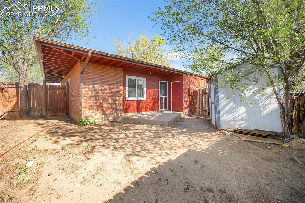 357-359 Fairway South Colorado Springs, CO 80906 - Photo 19 of 20 a view of a backyard with a large tree