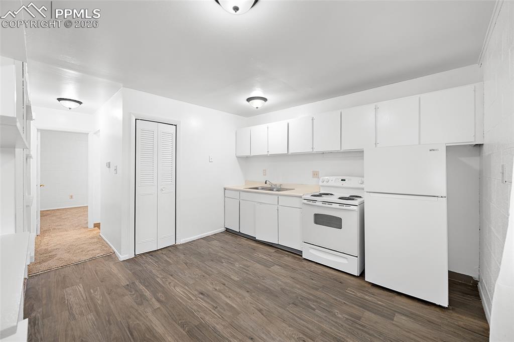 357-359 Fairway South Colorado Springs, CO 80906 - Photo 8 of 20 a kitchen with white cabinets and white appliances