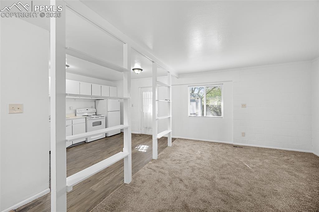 357-359 Fairway South Colorado Springs, CO 80906 - Photo 9 of 20 a view of an empty room with a window