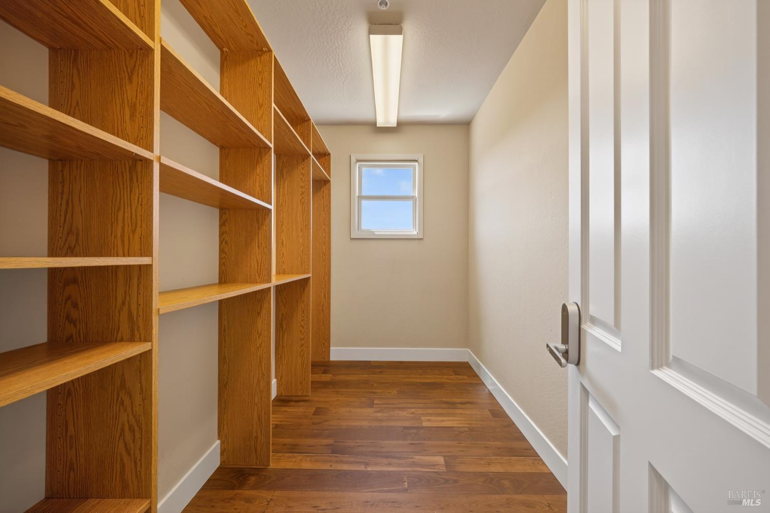 10 Lockton Lane Novato, CA 94945 - Photo 31 of 68 Walk-in closet with built-in shelving and generous storage, supporting the scale and function of the primary suite.