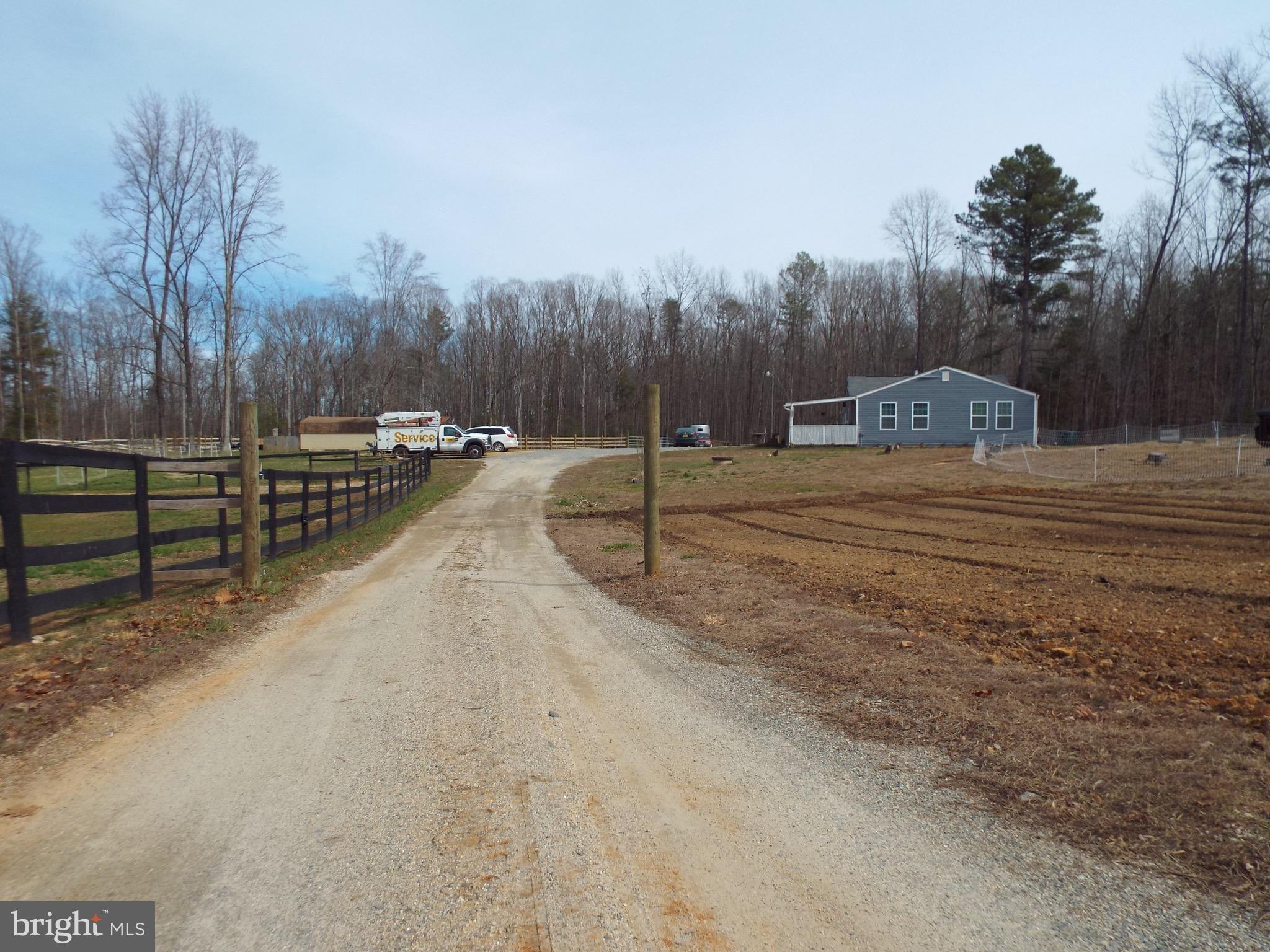 760 Greenes Corner Road Bumpass, VA 23024 - Photo 2 of 14 Down a path between the garden and Pasture to home