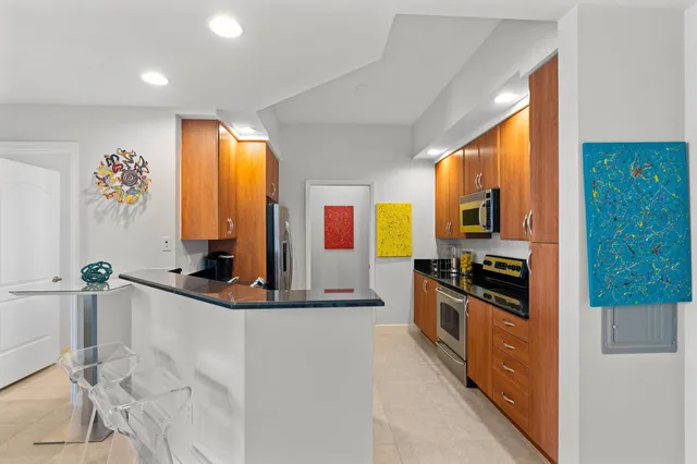 a kitchen with stainless steel appliances a sink and a stove