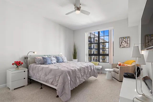 a bedroom with a bed and a couch