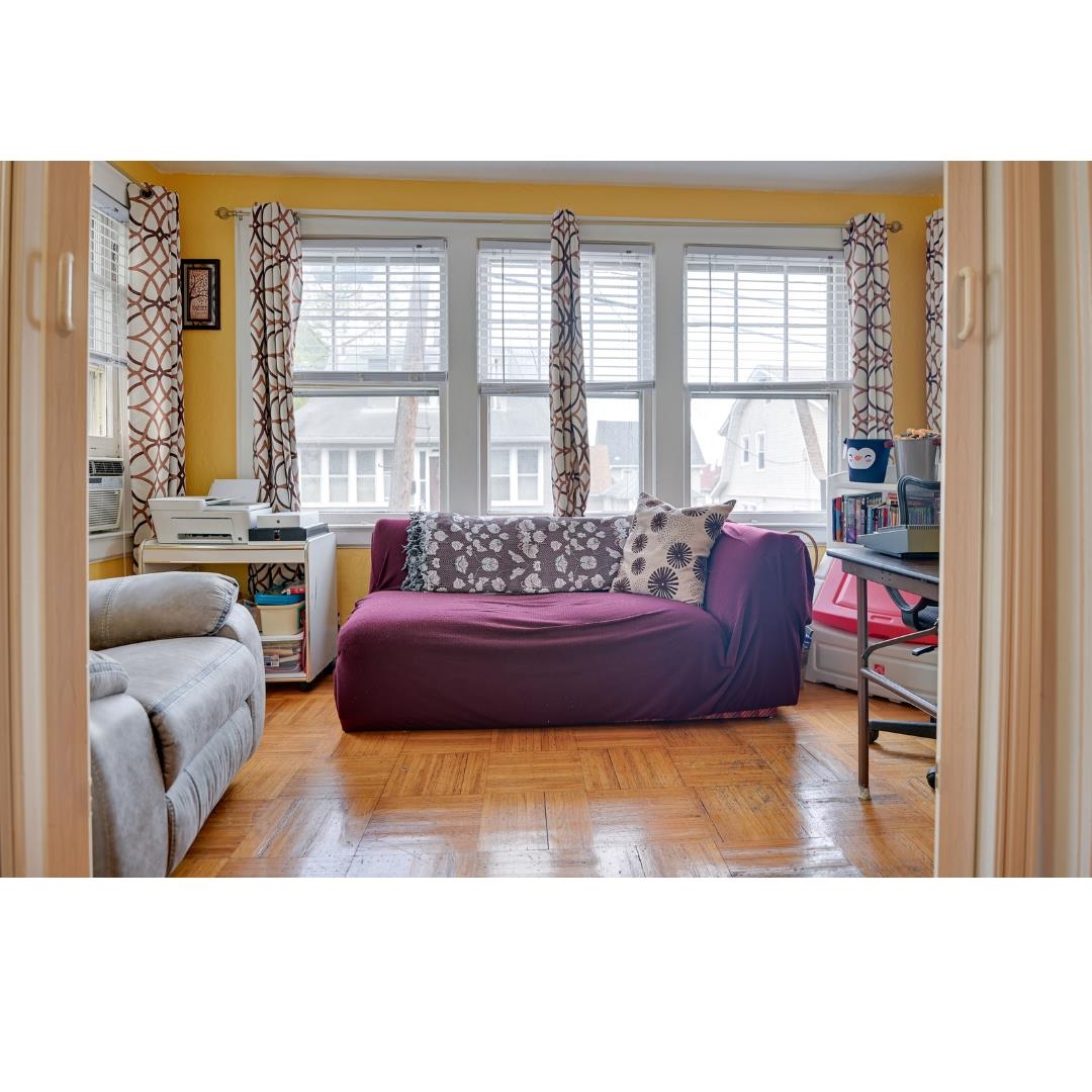 45 Ridgehurst Road West Orange, NJ 07052 - Photo 3 of 10 a living room with furniture and a large window