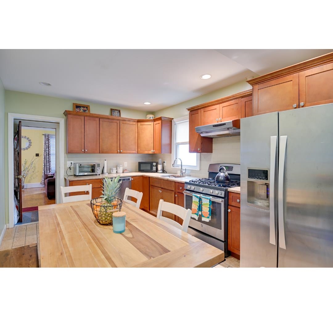 45 Ridgehurst Road West Orange, NJ 07052 - Photo 5 of 10 a kitchen with stainless steel appliances granite countertop a refrigerator and a stove top oven