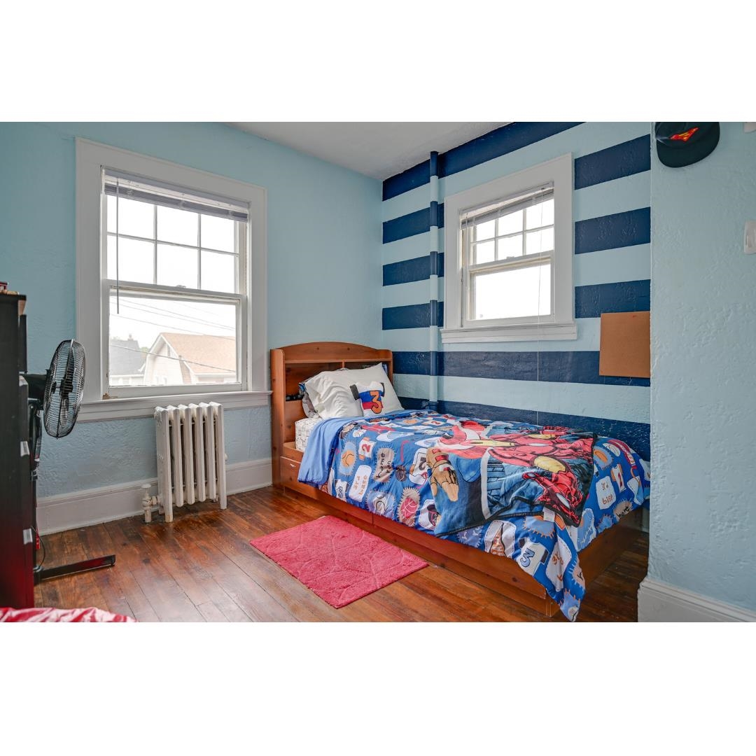 45 Ridgehurst Road West Orange, NJ 07052 - Photo 7 of 10 a bedroom with a bed and window