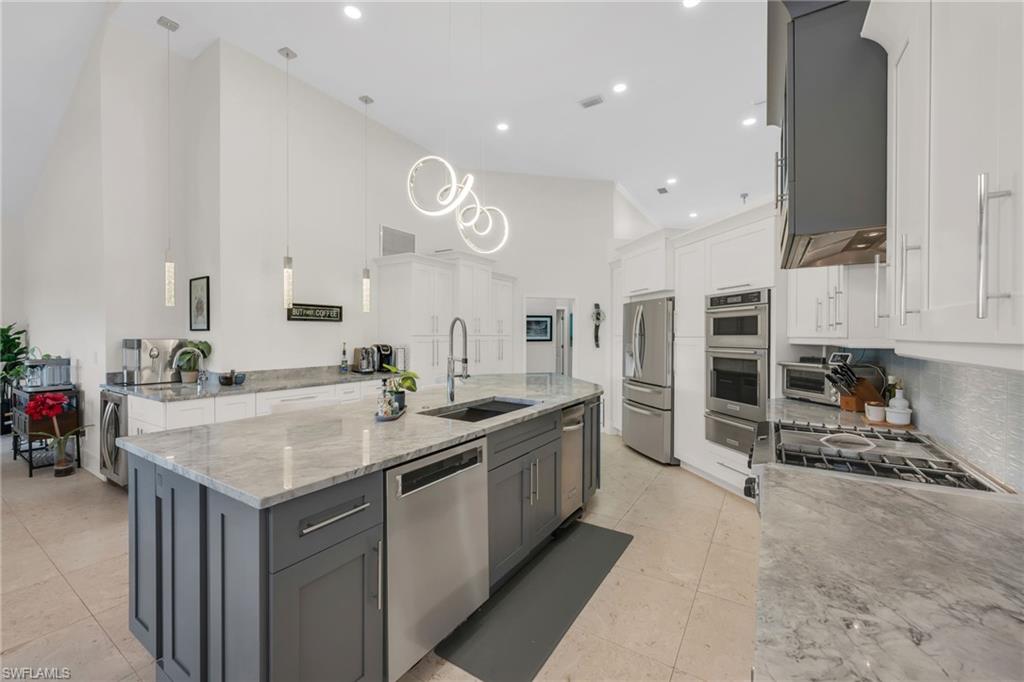 2041 Prince Drive Naples, FL 34110 - Photo 11 of 31 a kitchen with a sink and stove
