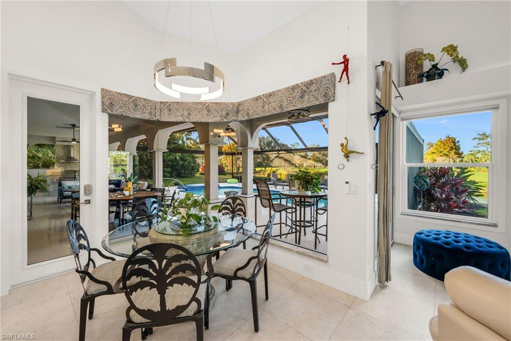 2041 Prince Drive Naples, FL 34110 - Photo 13 of 31 a view of a dining room with furniture window and outside view