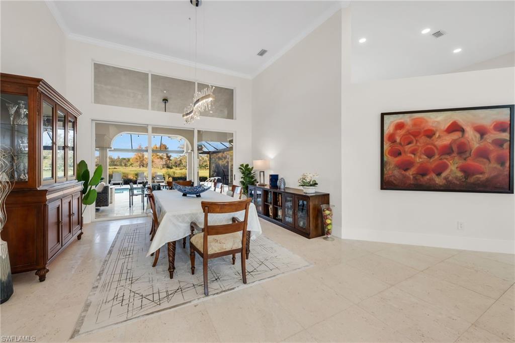 2041 Prince Drive Naples, FL 34110 - Photo 14 of 31 a dining room with furniture and a kitchen view