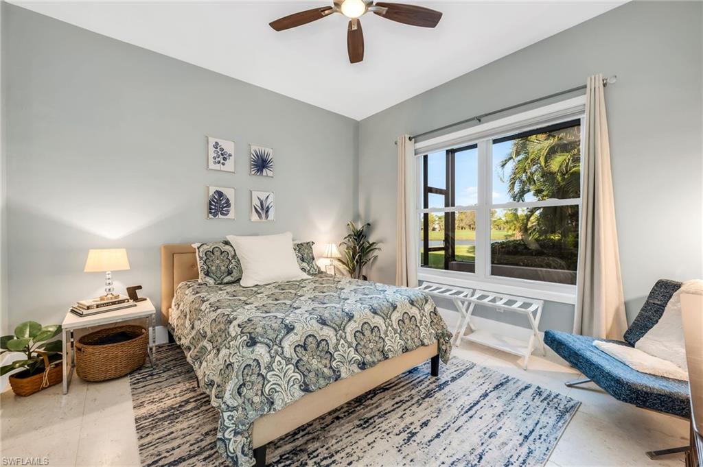 2041 Prince Drive Naples, FL 34110 - Photo 22 of 31 a bedroom with a bed and a large window