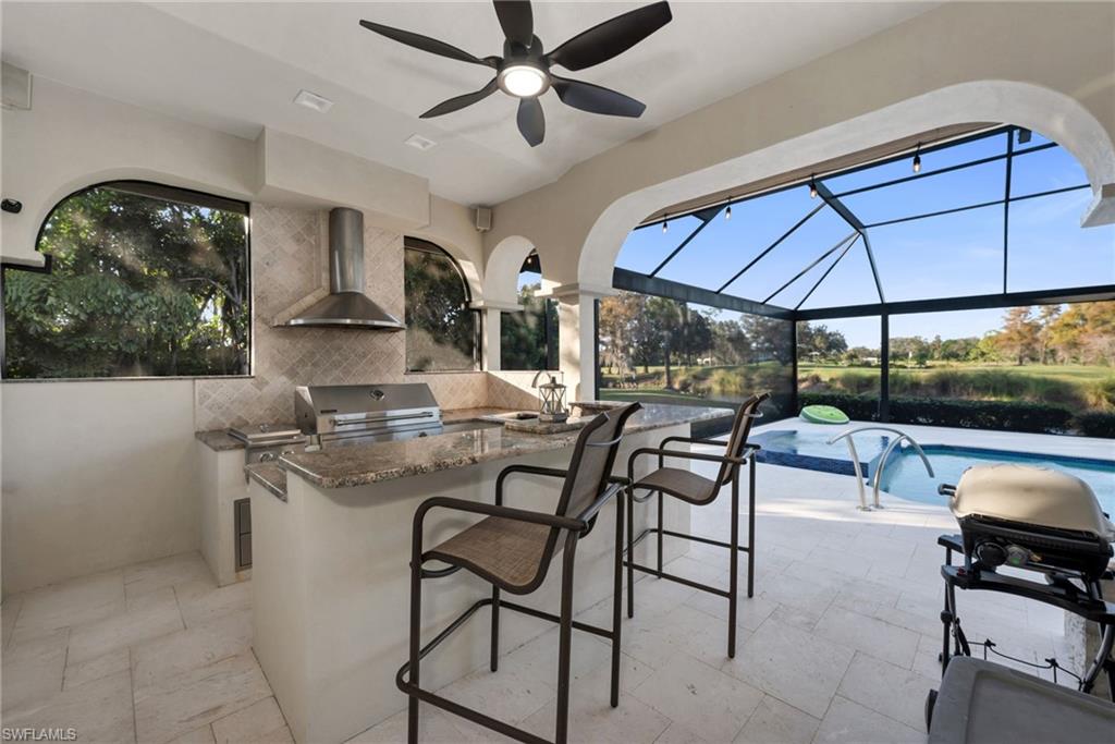 2041 Prince Drive Naples, FL 34110 - Photo 27 of 31 a view of a dining room with furniture and chandelier