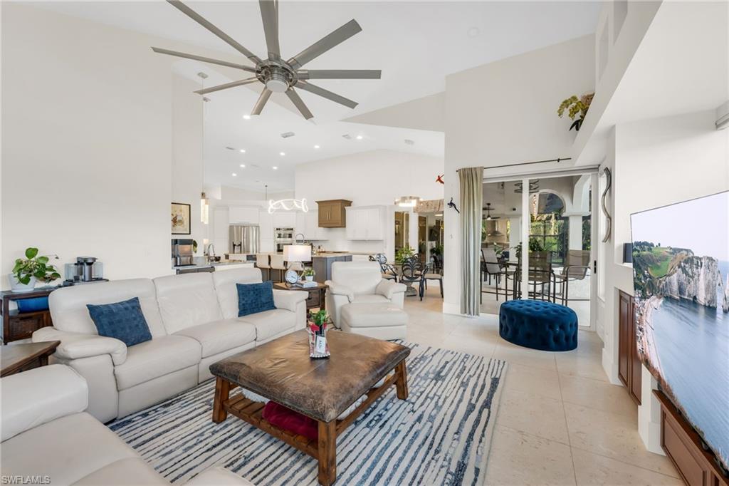 2041 Prince Drive Naples, FL 34110 - Photo 7 of 31 a living room with furniture potted plant and a large window