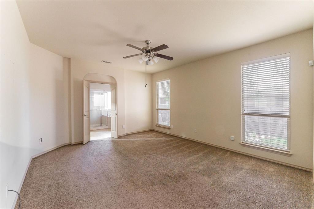 11156 Hawks Landing Road Fort Worth, TX 76052 - Photo 18 of 30 Spacious room featuring neutral carpeting, light-toned wall paint, and a ceiling fan with integrated lighting
