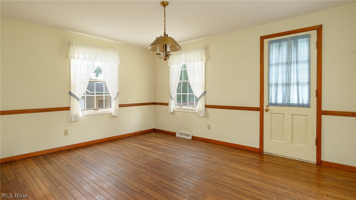 7199 Ward Road Cleveland, OH 44134 - Photo 13 of 33 Dining room features wood floors and easy access to back yard deck