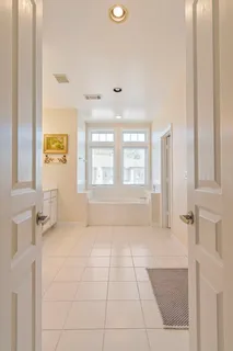 a bathroom with a bathtub and shower