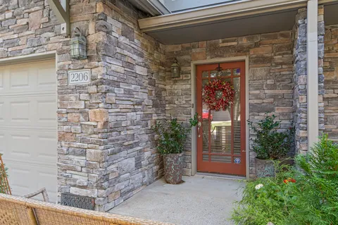 a front view of a house with a garage