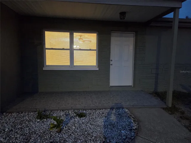 a view of a back yard of a house