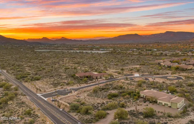 a view of a town with mountains in the background