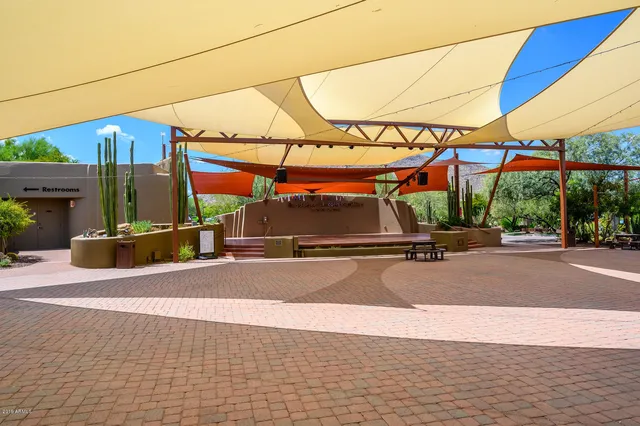 a view of a backyard with sitting area