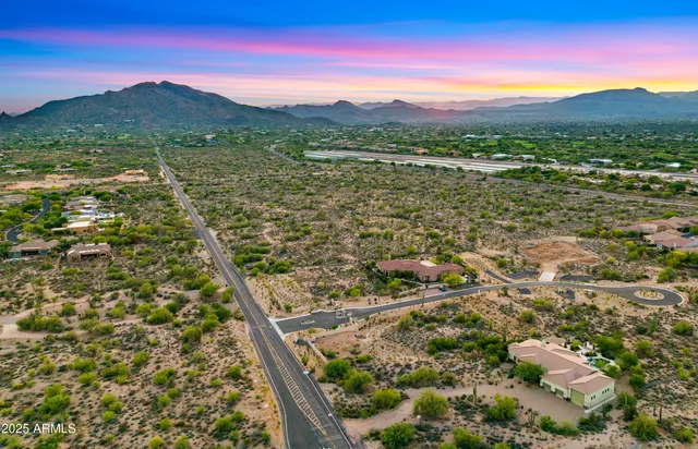 a view of a city with lush green forest