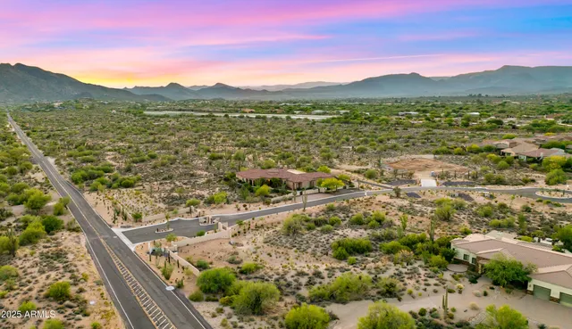 a view of a city with lush green forest