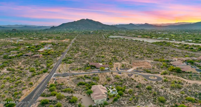 a view of a lush green hillside and a building