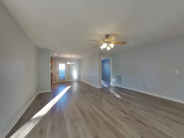 a view of gallery with wooden floor