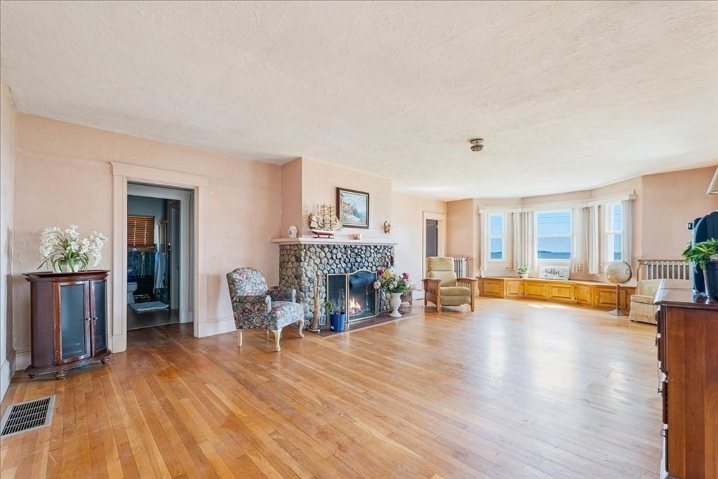 70 Hedge Road Plymouth, MA 02360 - Photo 11 of 41 a living room with furniture and a fireplace