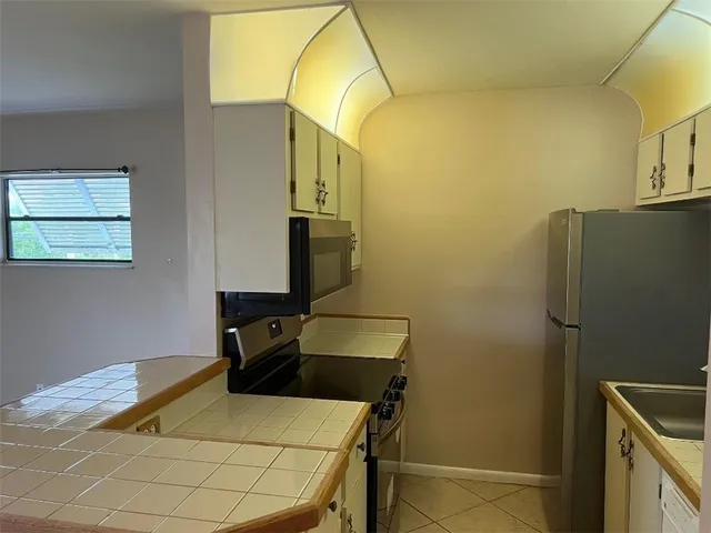 a bedroom with a bed and cabinets