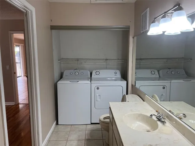a utility room with dryer and washer