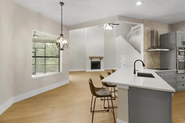 a kitchen with a table and chairs