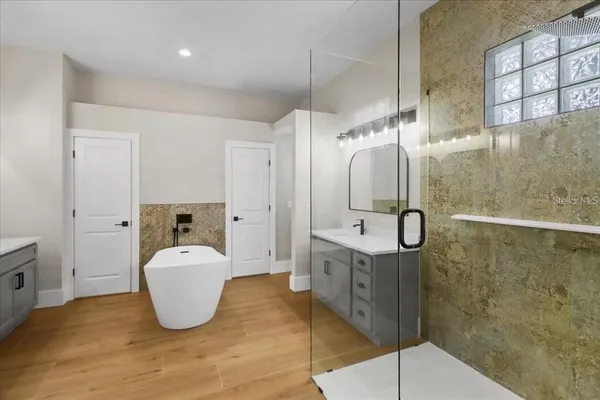 a bathroom with a sink and mirror