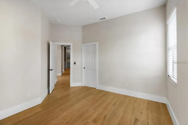 a view of hallway with wooden floor