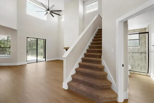 a view of an entryway with wooden floor and door