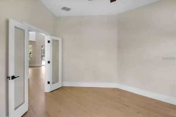a view of a bathroom with wooden floor