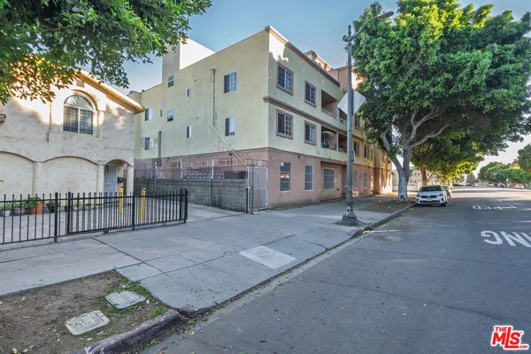 a view of a street with brick building in front of it