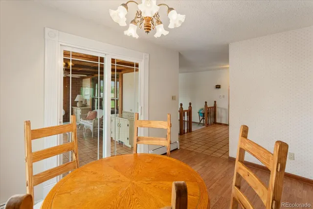 a bedroom with furniture and a chandelier