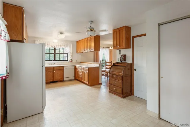 a kitchen with cabinets and stainless steel appliances