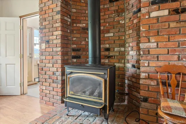 a living room with a couch a rug and a floor to ceiling window