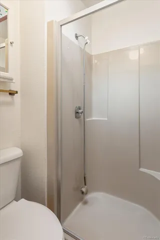 a bedroom with two beds and a table