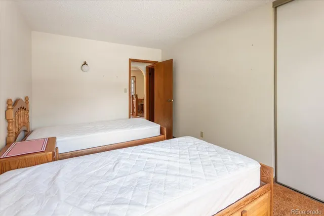 a bathroom with a double vanity sink toilet and shower
